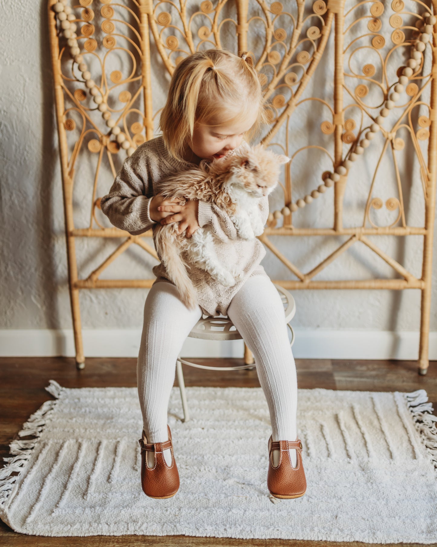 little girl in brown neutral soft soled shoe moccasins for barefoot shoes